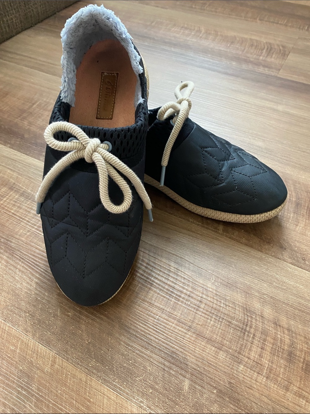 OluKai Black and Tan Lace-Up Quilted Sneakers